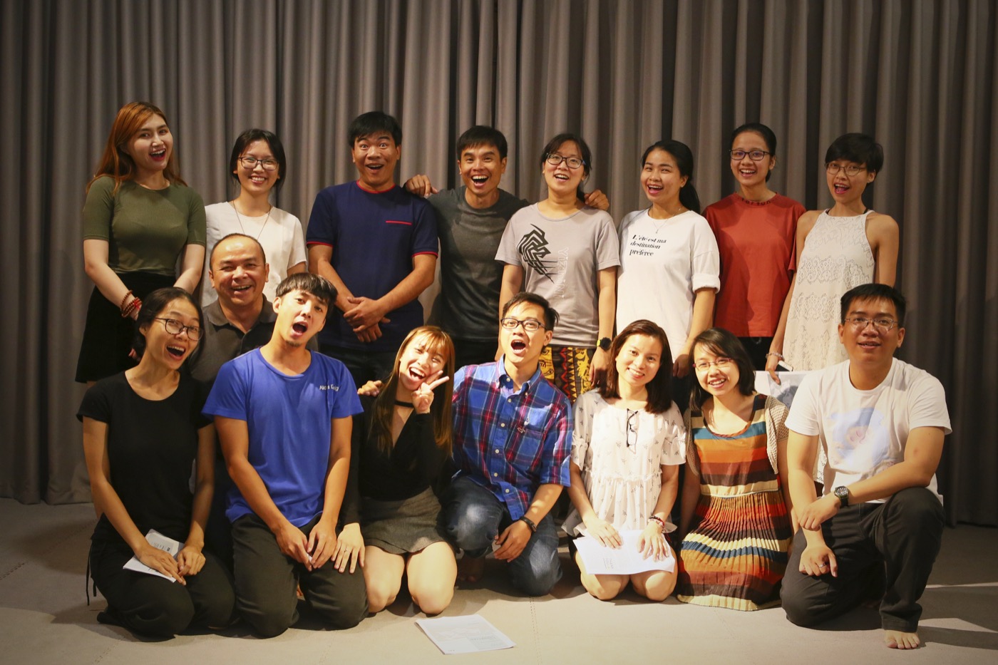 The whole workshop group of about seventeen people gathered for a photograph at the end of a session, most of them pulling faces or laughing